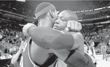  ?? ROBERT DUYOS/SUN SENTINEL ?? Monday sets up as the final on-court embrace between LeBron James, left, and Dwyane Wade.