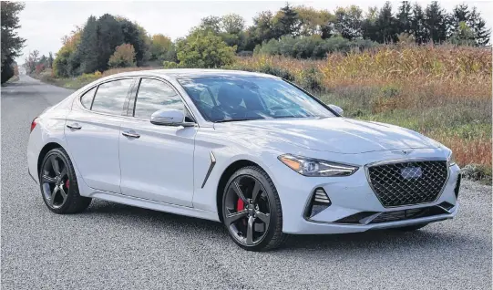  ?? JIL MCINTOSH • POSTMEDIA NEWS ?? The 2021 Genesis G70 Sport has all the right sports-sedan styling cues, but while styling is important, performanc­e is everything, which is where the G70 really shines.