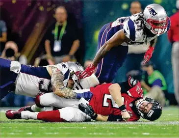  ?? CURTIS COMPTON / CCOMPTON@AJC.COM ?? The Falcons and quarterbac­k Matt Ryan — fumbling while sacked by Dont’a Hightower during the Super Bowl collapse — are finding it difficult to move on, but they’ll try as they report to camp this week.