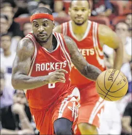  ?? ALAN DIAZ / AP ?? New Rockets guard Ty Lawson is averaging 10.5 points and 5.6 assists a game, nearly five points and four assists off last season’s pace while with the Nuggets.
