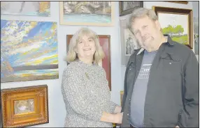  ?? (NWA Democrat-Gazette/Rachel Dickerson) ?? Rosie and Dave Floyd are pictured with a variety of Rosie’s paintings in her studio at their home in
Bella Vista.