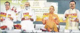  ?? DHEERAJ DHAWAN/HT PHOTOS ?? ■ Chief minister Yogi Adityanath releasing a booklet on the completion of two-and-a-half-years of his government in Lucknow on Thursday.