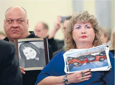  ?? Photo: REUTERS ?? Mary Theresa Ruddy, whose daughter Kelly was killed in 2010 when she lost control of her Chevrolet Cobalt, holds a picture of the vehicle, while her husband Leo holds a photo of their daughter at a United States Senate subcommitt­ee hearing into car...