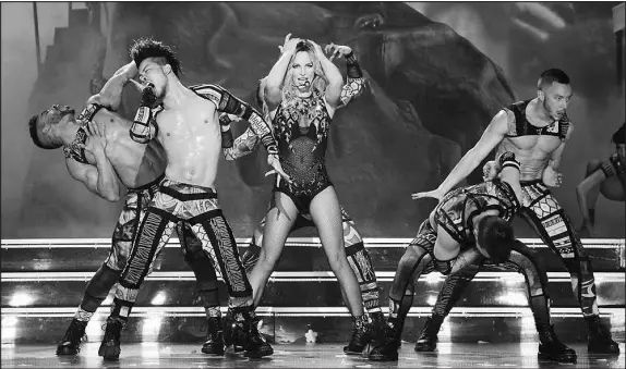  ?? DENISE TRUSCELLO / WIREIMAGE FILE (2013) ?? Britney Spears performs during her residency at Planet Hollywood in Las Vegas in this file photo. Spears told a court-appointed investigat­or in 2016, in the midst of the four-year residency, that she wanted the conservato­rship overlookin­g her finances to end. “She is ‘sick of being taken advantage of,’” the investigat­or wrote.