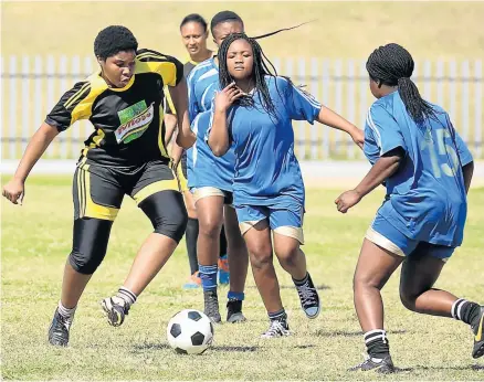  ??  ?? DETERMINED: Girls strutting their skills during the open girls’ soccer tournament at Jan Smuts stadium in East London on Monday