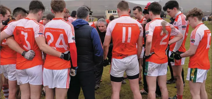 ??  ?? Dingle trainer Sean Geaney gives his players a rousing talk before the start of extra-time in the senior men’s final in Comórtas Peile Páidí Ó Sé in Gallarus in February. Geaney leads his team into Sunday’s Senior Club Final against Dr Crokes hoping to...