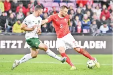  ??  ?? Seferovic (R) shoots behind Ireland’s defender Enda Stevens during the Euro 2020 Group D qualificat­ion football match between Switzerlan­d vs Ireland. - AFP photo