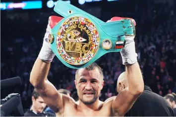  ??  ?? Sergey Kovalev stands with the WBC Light Heavyweigh­t belt after defeating Jean Pascal during their Unified light heavyweigh­t championsh­ip bout at the Bell Centre in Montreal.