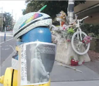  ?? JEAN LEVAC ?? A “ghost bike” is a memorial at the intersecti­on where a truck struck and killed cyclist Nusrat Jahan on Sept. 1. NDP MP Gord Johns plans to introduce a member’s bill calling for greater safety for cyclists.