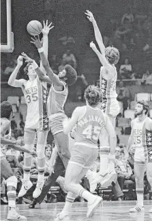  ?? Associated Press ?? Dwight Jones, center, who played his high school ball at PVIL powerhouse Wheatley, went on to play for the Rockets.