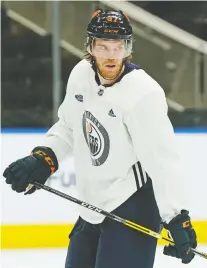  ?? LARRY WONG ?? Oilers captain Connor Mcdavid skated at the team practice in Edmonton on Thursday. He has been out of action due to a leg injury and is listing himself as day-to-day as he recovers.