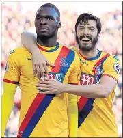  ??  ?? AT THE DOUBLE: Benteke is congratula­ted after scoring the winner against his former club, but was muted in his own celebratio­ns