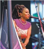  ?? K.C. ALFRED U-T ?? Harpist Mariea Antoinette performs at the annual Kwanzaa celebratio­n at the WorldBeat Cultural Center in Balboa Park on Sunday.