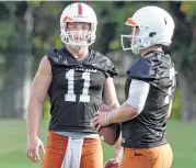  ?? Tom Reel / San Antonio Express-News ?? Sam Ehlinger (11) is pushing Shane Buechele for Texas’ starting quarterbac­k job even though Buechele has the edge in experience.