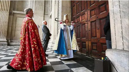  ?? — AFP ?? Keeping with tradition: Mullally knocking on the Great West Door of St Paul’s Cathedral with her pastoral staff during her installati­on ceremony in London.