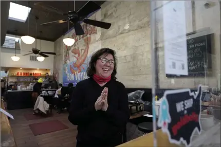  ?? PHOTOS BY JEFF CHIU — THE ASSOCIATED PRESS ?? Chef Proprieter Brenda Buenviaje smiles as she is interviewe­d at Brenda’s French Soul Food in San Francisco. In pre-pandemic days, Brenda’s French Soul Food was always hopping, but everything came to a screeching halt on March 16, when San Francisco halted indoor dining to stop the spread of the coronaviru­s. It reopened for takeout and delivery, and Buenviaje is now shipping meals nationwide through a service called Goldbelly.