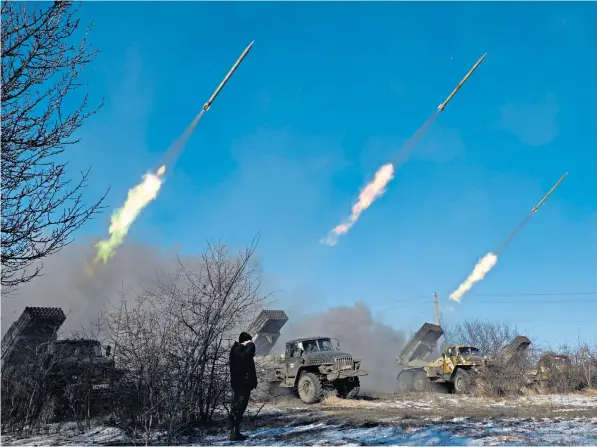  ?? ?? Pro-russian rebels fire rockets towards Debaltseve, Ukraine, in 2015; Ben Wallace, left