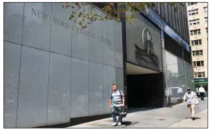  ?? AP/RICHARD DREW ?? People walk past the Archdioces­e of New York building last week in New York City.