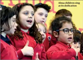  ?? PHOTO: JO MIESZKOWSK­I ?? Alma children sing at its dedication