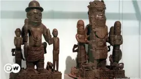  ??  ?? Two sculptures of large humans flanked by two smaller people each from the Benin bronzes collection