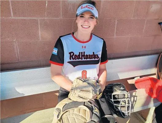  ?? TONY BARANEK/DAILY SOUTHTOWN ?? Marist senior Emily Bojan gets ready with her catching equipment before a preseason practice on March 9.