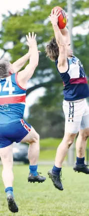  ??  ?? Shayne Crawford takes a first quarter grab for Kilcunda Bass in front of Bunyip’s Desmond Young.