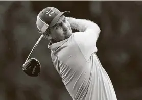  ?? Mark Humphrey / Associated Press ?? Brendon Todd, who shot a 65 at TPC Southwind on Friday, watches his tee shot on No. 2 at World Golf Championsh­ip-FedEx St. Jude Invitation­al.