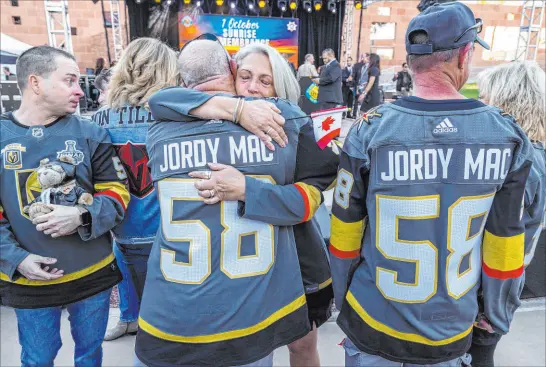  ?? L.E. Baskow
Las Vegas Review-journal @Left_eye_images ?? Family and friends of Jordan Mcildoon comfort each other Saturday at the Sunrise Remembranc­e Ceremony to honor the 60 lives lost at the Route 91 Harvest festival shooting. Mcildoon was among four Canadians killed.