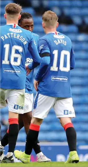  ??  ?? Steven Gerrard congratula­tes his goalkeeper after a stellar performanc­e against old rivals Celtic in the Scottish Cup