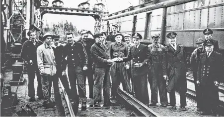  ?? STRAIT AREA MUSEUM PHOTO ?? The crew that worked the final crossing of the S.S. Scotia II train ferry leaving the C.N.R. Mulgrave marine crossing to the C.N.R. Point Tupper marine terminal. From left: Bobby Carter, Donald MacDonald, G.B. Hadley, Paul Kennedy, Murray Forrestall, Victor Cordeau, Burt Decoste, Alohone O’Neil, Charlie Davis, Bernie Decoste, George Hadley, Warren England, Johnnie H. Crittenden, Mike MacDonald, Tommy Moore and Tommy MacDonald.
