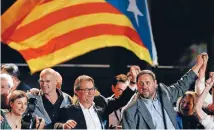  ?? PHOTO: REUTERS ?? Catalan President Artur Mas, centre, and other pro-independen­ce politician­s celebrate the result of the election in Catalonia.