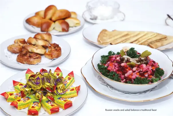  ??  ?? Russian snacks and salad balance a traditiona­l feast