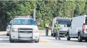  ?? GERARDO MORA/GETTY IMAGES ?? Palm Beach County Sheriff’s deputies monitor traffic at President-elect Trump’s Mar-A-Lago resort in November.