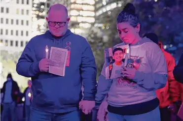  ?? Photos by Elizabeth Conley/staff photograph­er ?? Janel Rodriguez of Hays County and her husband, Brandon Dunn, attend a vigil last week in Houston for people who have died of overdoses. Rodriguez’s son, Noah, 15, died of fentanyl poisoning in August.