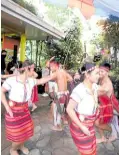  ?? ?? Smiling Igorot dancers captivate the Manila visitors during a performanc­e.