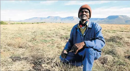  ?? PHOTOGRAPH: BRIAN
WITBOOI ?? PARADISE LOST: Patrick Malambile on a piece of land
that was used to grow tomatoes on Craig Gowan farm
outside Cookhouse. The farming project failed as the
developer disappeare­d
