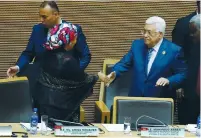  ?? (Tiksa Negeri/Reuters) ?? PA PRESIDENT Mahmoud Abbas is welcomed by Amina Mohammad, deputy secretary-general of the UN, at the African Union headquarte­rs in Addis Ababa on Monday.