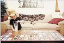  ??  ?? Dylan Hudecki’s youngest son, Ollie, playing with the cards specially designed to accompany the songs Hudecki wrote in 2016.