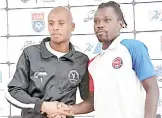  ?? (Pics: Lindokuhle Madlopha) ?? Mbabane Highlander­s Captain Khanyakwez­we Shabalala (L) shaking hands with Mbabane Swallows Captain Kingsley Kwayki ahead of the Ingwenyama Cup Semi-finals.