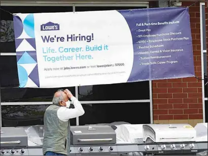  ?? ?? A hiring sign is displayed at a home improvemen­t store in Northbrook, Ill., Thursday, May 5, 2022. America’s employers added 428,000 jobs in April, extending a streak of solid hiring that has defied punishing inflation, chronic supply shortages, the Russian war against Ukraine and much higher borrowing costs. (AP)