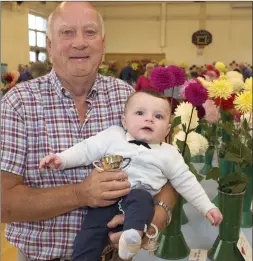  ??  ?? James Kilkenny,winner of best in class for dahlias grown without covers, and his grandson Finn Kilkenny.