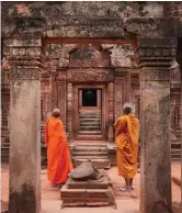  ??  ?? Monks in saffroncol­oured robes are a common sight in Siem Reap