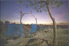  ??  ?? A gate stands open at the church where Tigrayan refugee Abraha Gebremaria­m prays in Hamdayet. More than 62,000 refugees from Ethiopia’s embattled Tigray region are in Sudan.