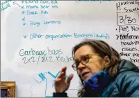  ?? ?? Delivering naloxone to far-flung communitie­s in northeast Minnesota is challengin­g for groups like Harm Reduction Sisters, which gets free injectable naloxone through Remedy Alliance. A whiteboard behind Sue Purchase lists needed supplies.