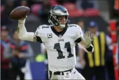 ?? TIM IRELAND — THE ASSOCIATED PRESS ?? Philadelph­ia Eagles quarterbac­k Carson Wentz (11) passes the ball during the first half of an NFL football game against Jacksonvil­le Jaguars at Wembley stadium in London, Sunday.