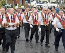  ?? ?? Orangemen parade on the streets of Belfast.