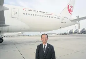  ?? BOONSONG KOSITCHOTE­THANA ?? Mr Morimoto stands in front of a retrofit B777200ER at Suvarnabhu­mi airport. Amid fierce competitio­n, JAL hopes to win more passengers with the deployment of the aircraft and a renovated airport lounge.