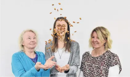  ?? PHOTO: GREGOR RICHARDSON ?? Nuts for nuts . . . Researcher­s (from left) Alexandra Chisholm, Lara Ware and Rachel Brown are urging people to start enjoying the nutritiona­l benefits of eating nuts.