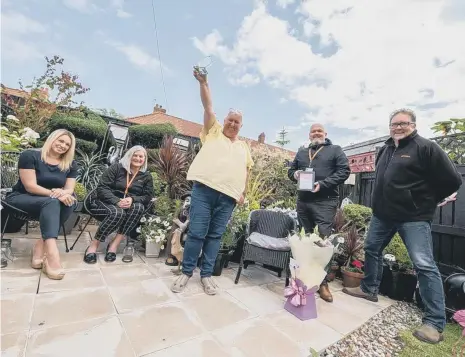  ??  ?? Top gardener Susan Remmer, centre, with, from left, Amy Phillips, Cath Loftus, Anthony Longord and Nigel Wilson.