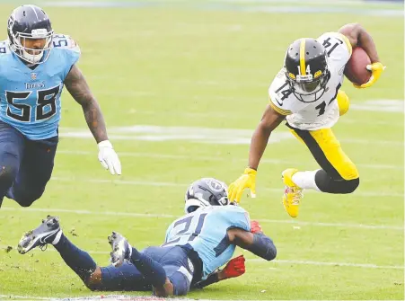  ?? STEVE ROBERTS/ USA TODAY SPORTS ?? Titans cornerback Malcolm Butler tackles Steelers wide receiver Ray-Ray McCloud during the second half of their game Sunday in Nashville. The Steelers jumped out to a big lead by the third quarter and then hung on to beat the Titans, 27-24.